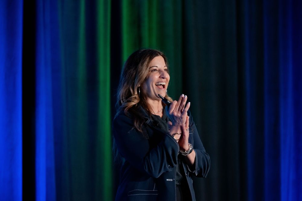 CEO keynote speaker on stage during a convention.