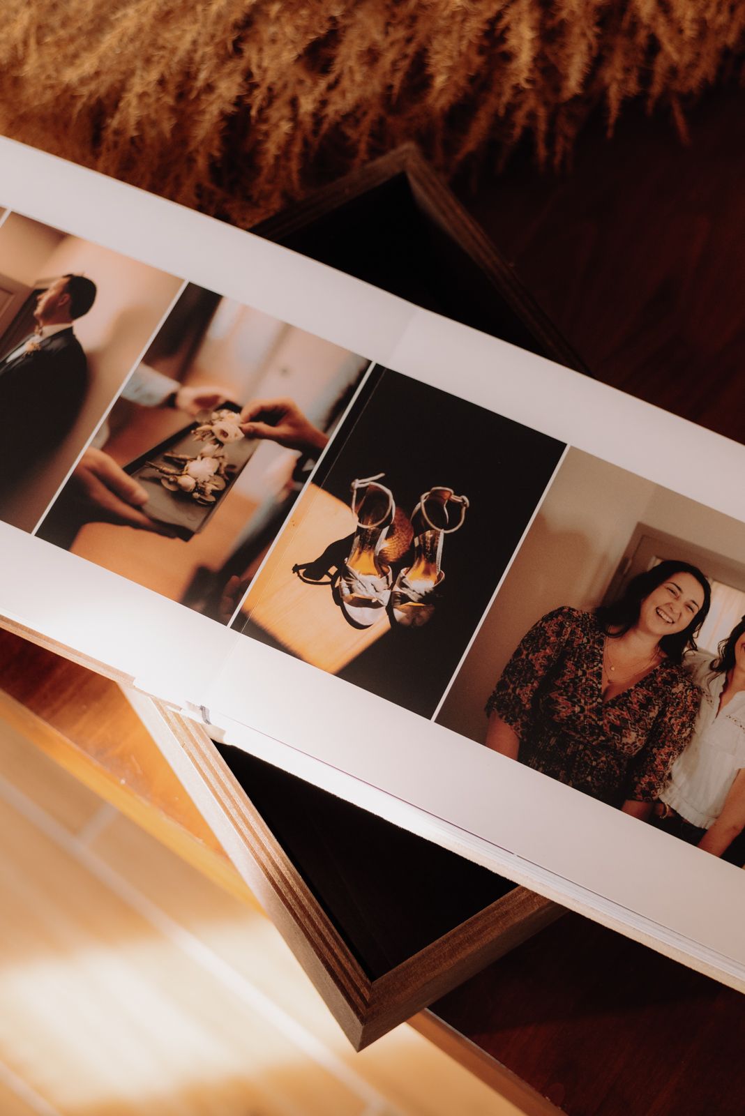 Wedding album spread showing detail photos of shoes and celebration moments.