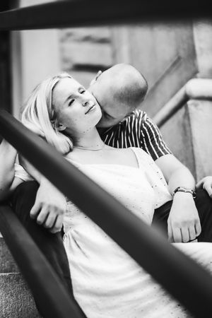 Black and white photo series showing someone reclining and resting against a dark surface.