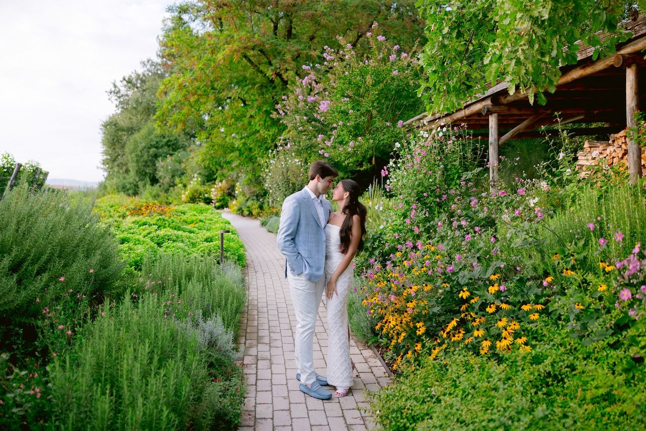 Bride and groom portrait in a lush garden during their rehearsal dinner at a Lake Garda wine resort