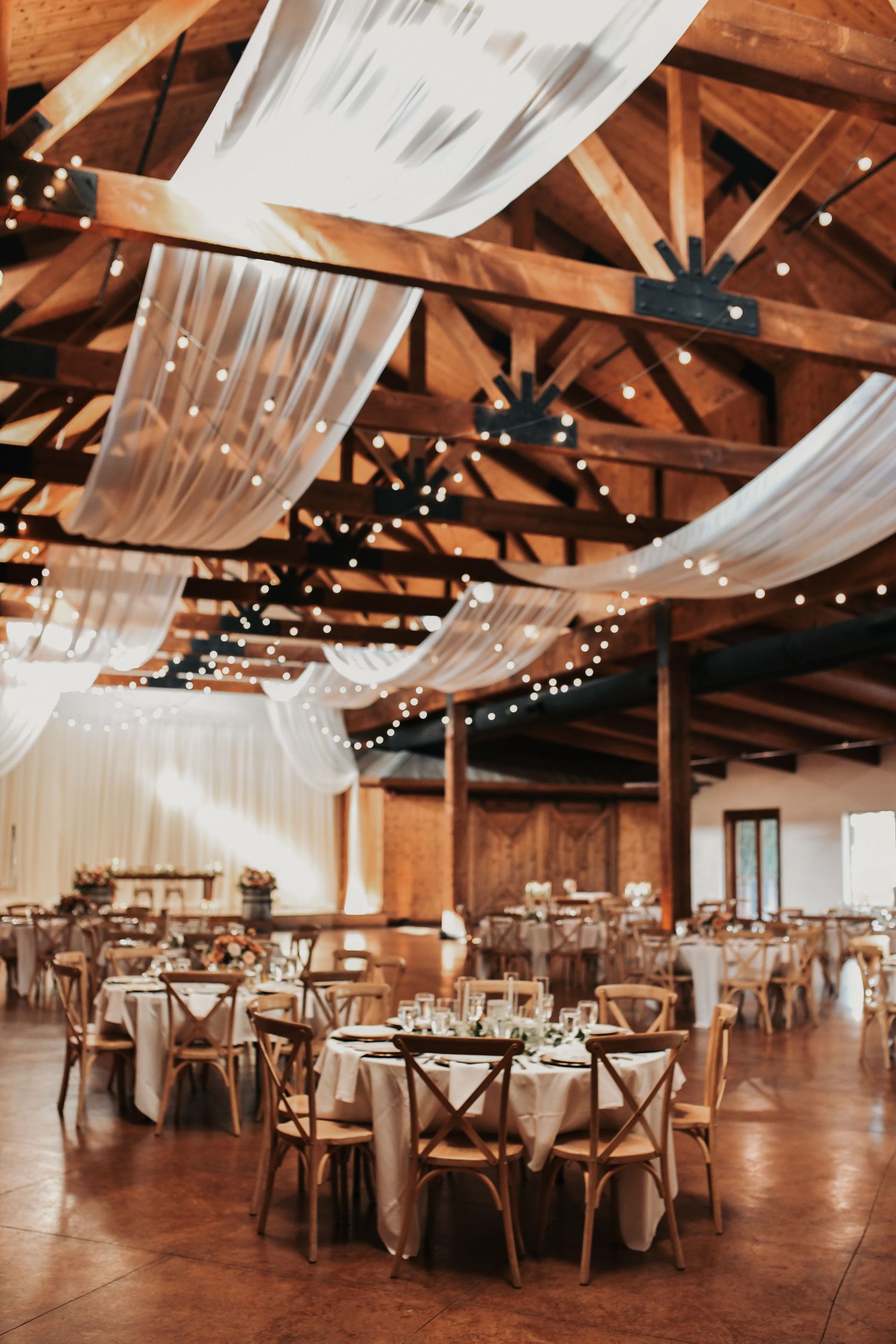 Elegant gold wedding details inside the reception space at Lucky Spur Ranch