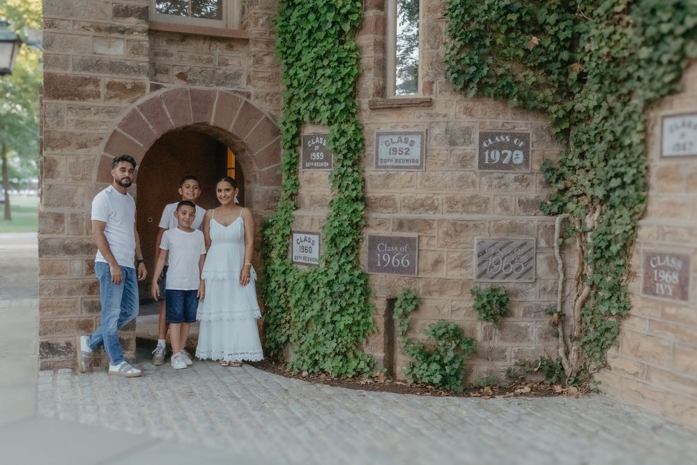 Family of four in front of an ivy-covered building at Princeton University, New Jersey