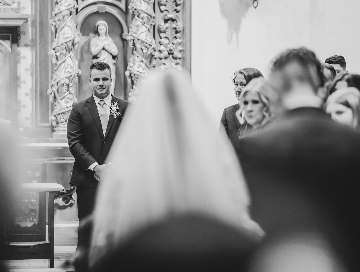 Bride and groom participating in Catholic wedding Mass in Coppell