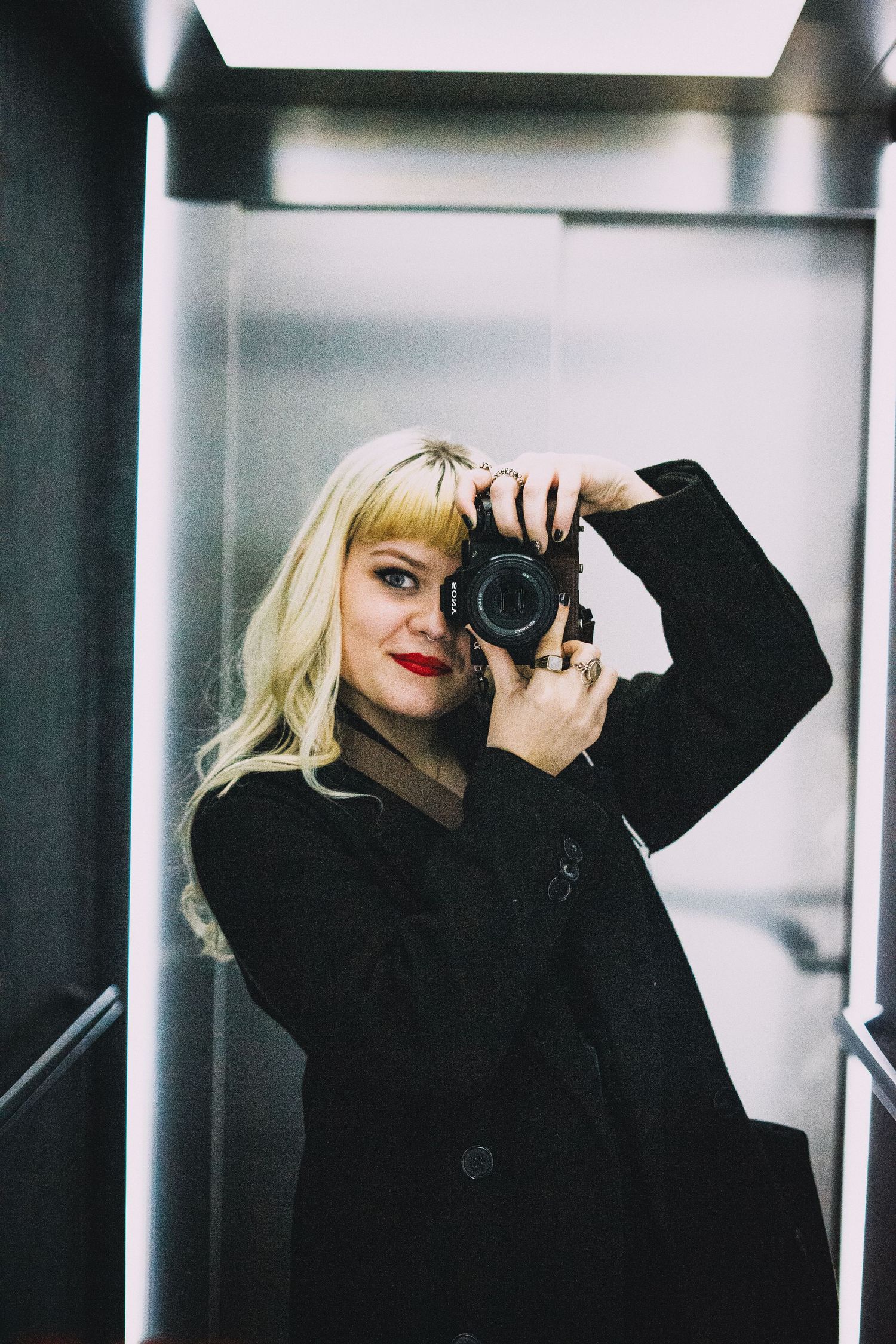 photo of Millie the photographer for Hells Belles Photography whilst shooting an alternative wedding