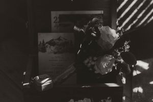 Dark moody floral arrangement and decor details captured in black and white.