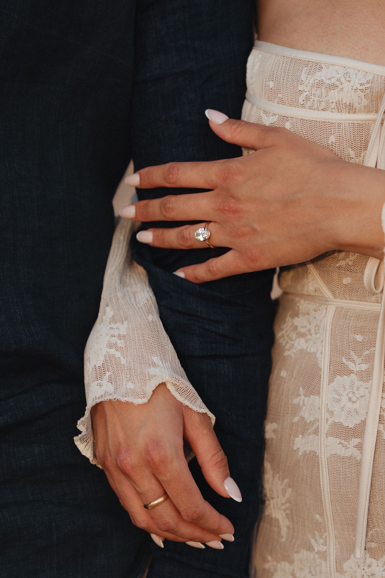 Surprise proposal photoshoot in Dubai – close-up of hands with engagement ring