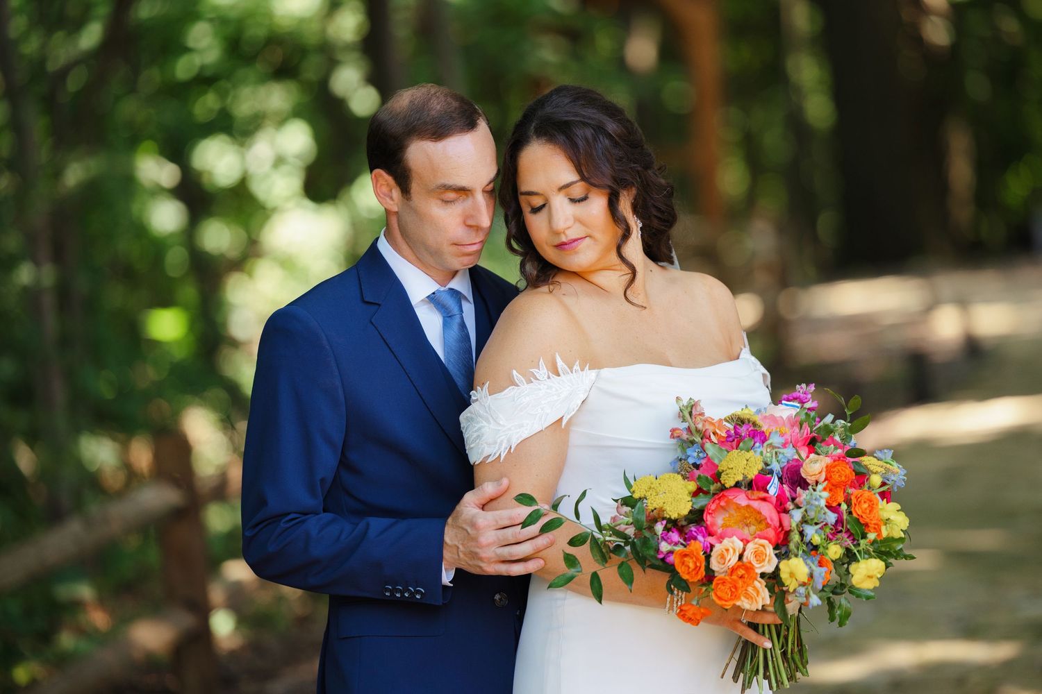 Bride and groom embrace during their wedding day at Tall Oaks East photographed by Tom Forrest Photography of Hudson, Ohio.