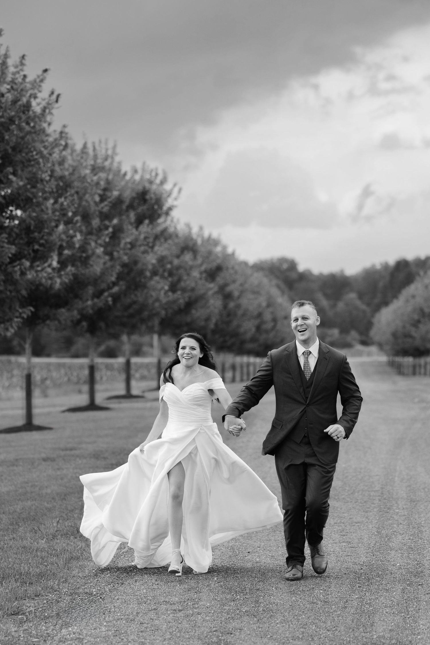 Bride and groom running and happy photographed by Tom Forrest Photography of Hudson, Ohio.