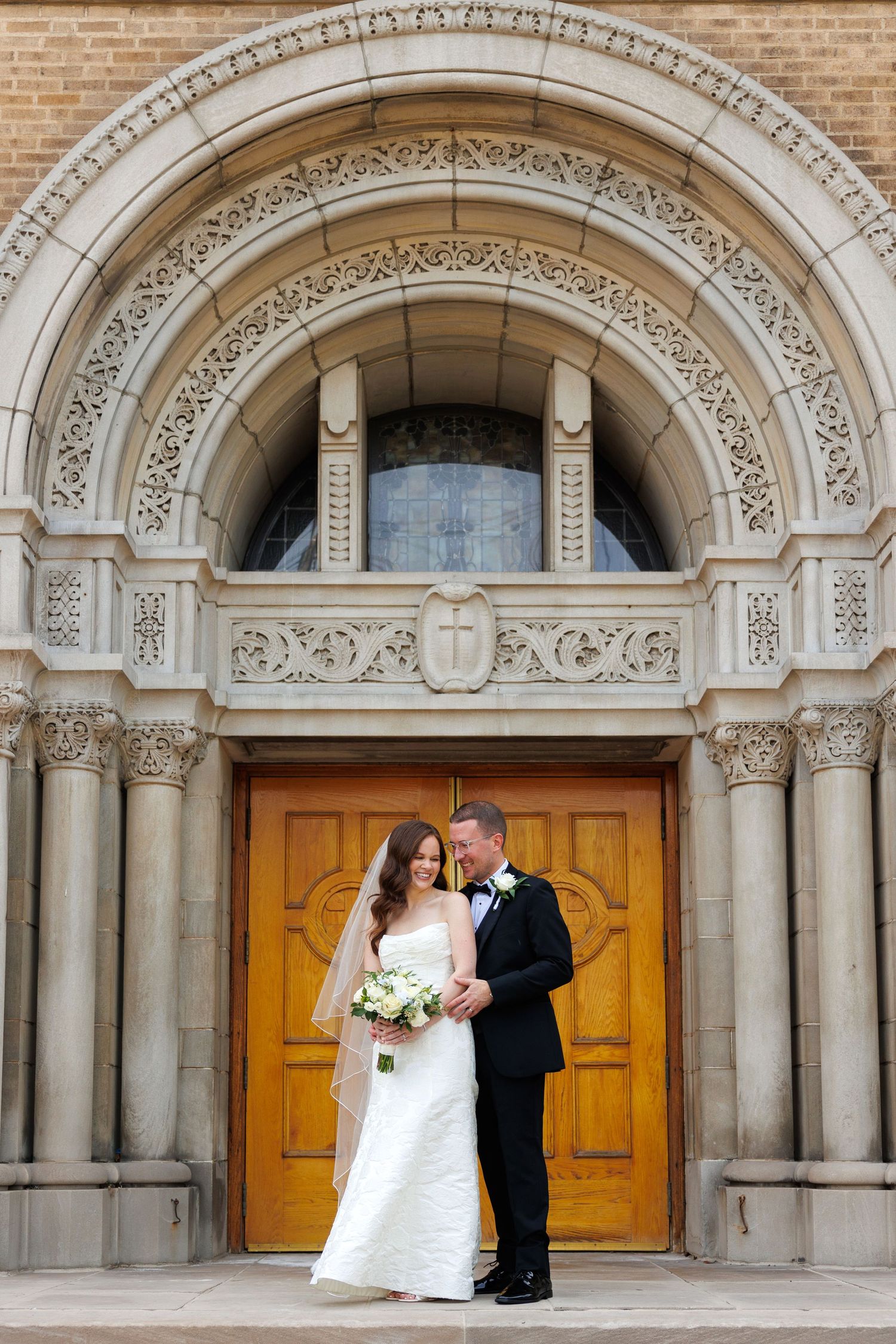 Bride and groom in front of Cleveland church photographed by Tom Forrest Photography of Hudson, Ohio.