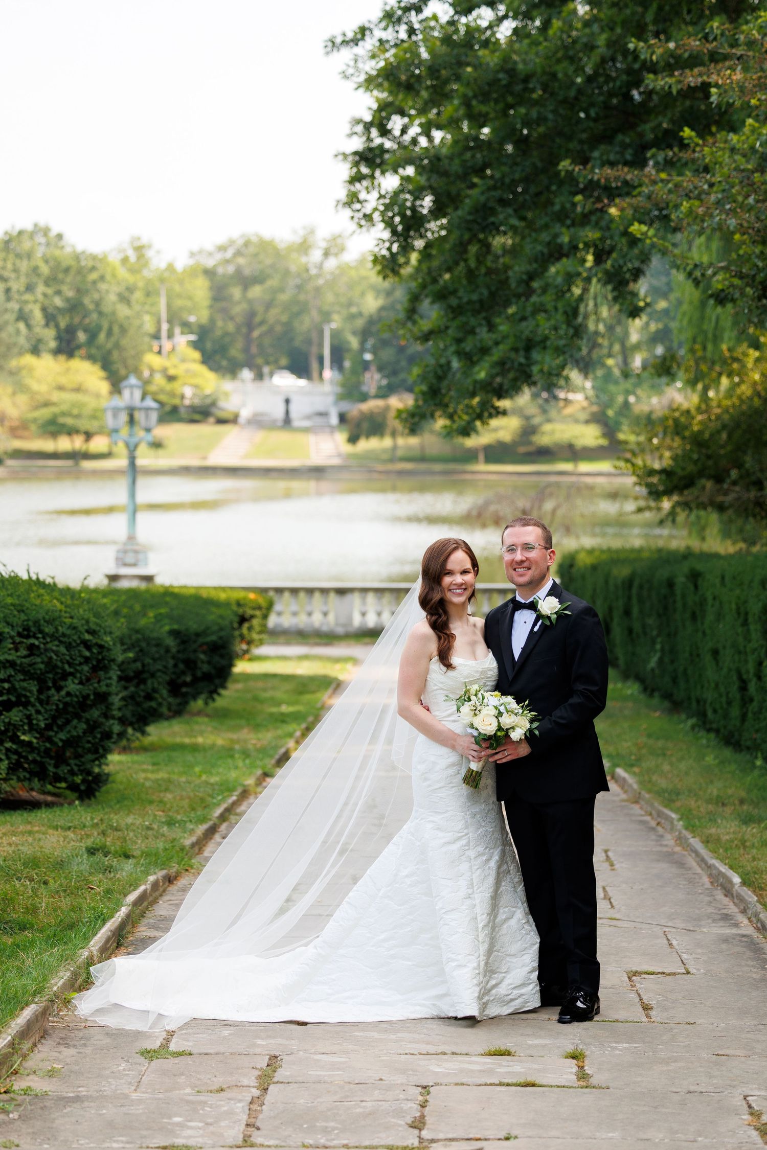Bride and groom embrace outside Cleveland Museum of Art photographed by Tom Forrest Photography of Hudson, Ohio.