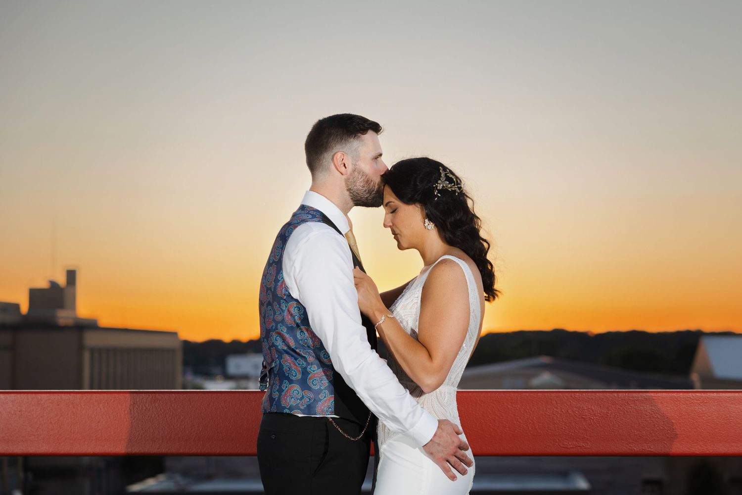 Sunset portrait of newlyweds on rooftop of Historic Onesto in Canton photographed by Tom Forrest Photography of Hudson, Ohio.