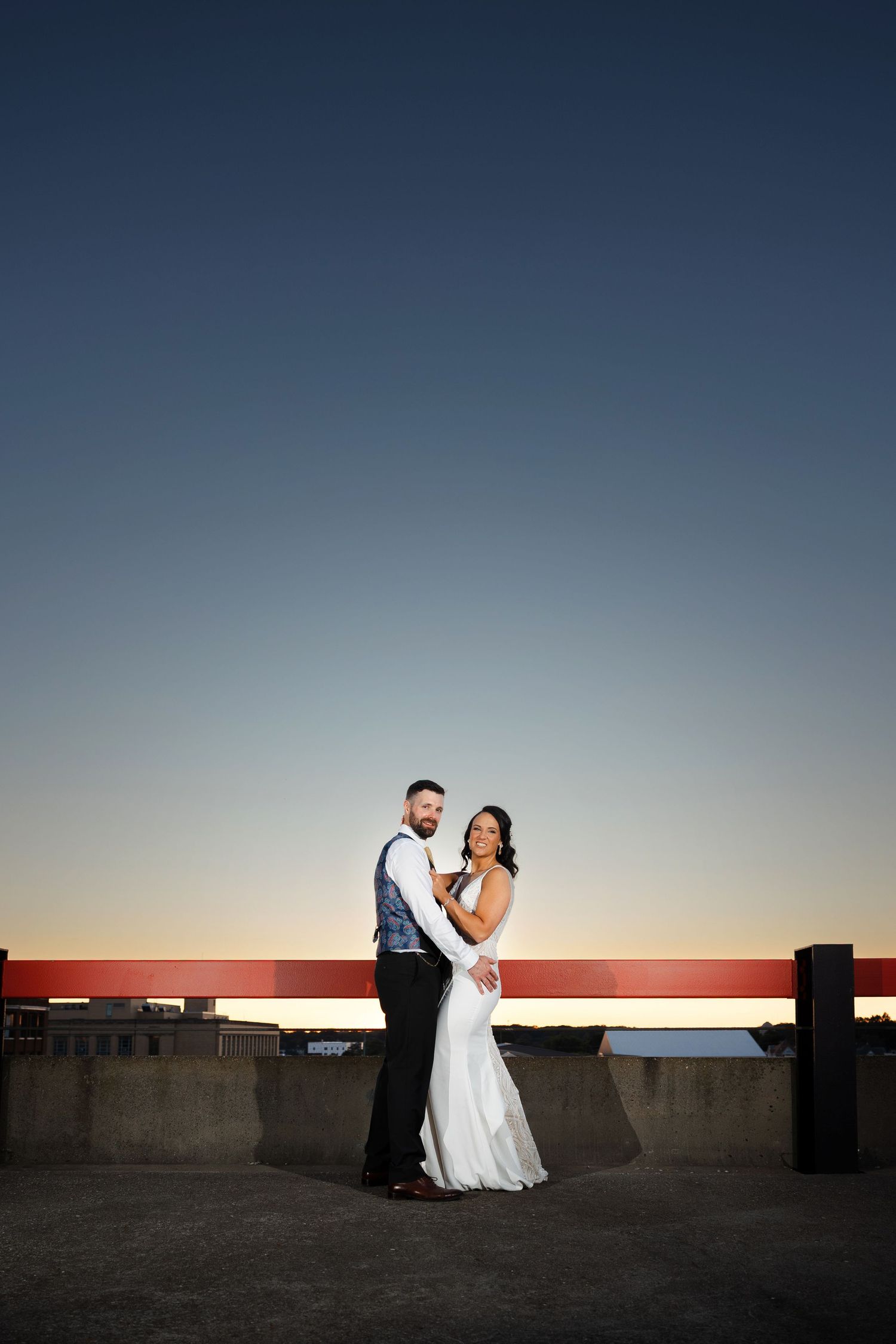 Sunset portrait of newlyweds on rooftop of Historic Onesto in Canton photographed by Tom Forrest Photography of Hudson, Ohio.