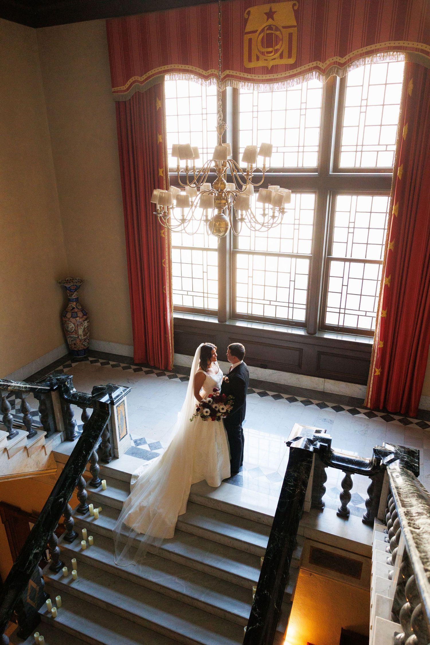 Bride and groom on staircase at The Union Club photographed by Tom Forrest Photography of Hudson, Ohio.