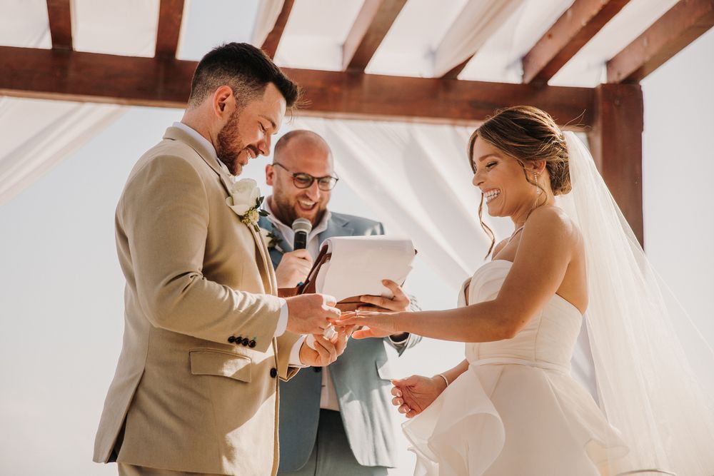 A series of candid moments during a wedding ceremony showing couples dancing and celebrating together in a bright venue. El Dorado Royale