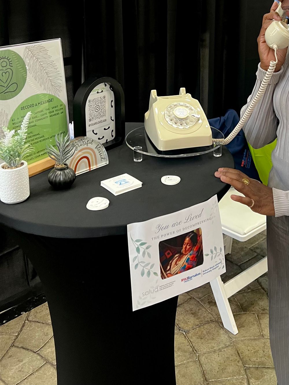 an audio guestbook set up with a beige rotary phone