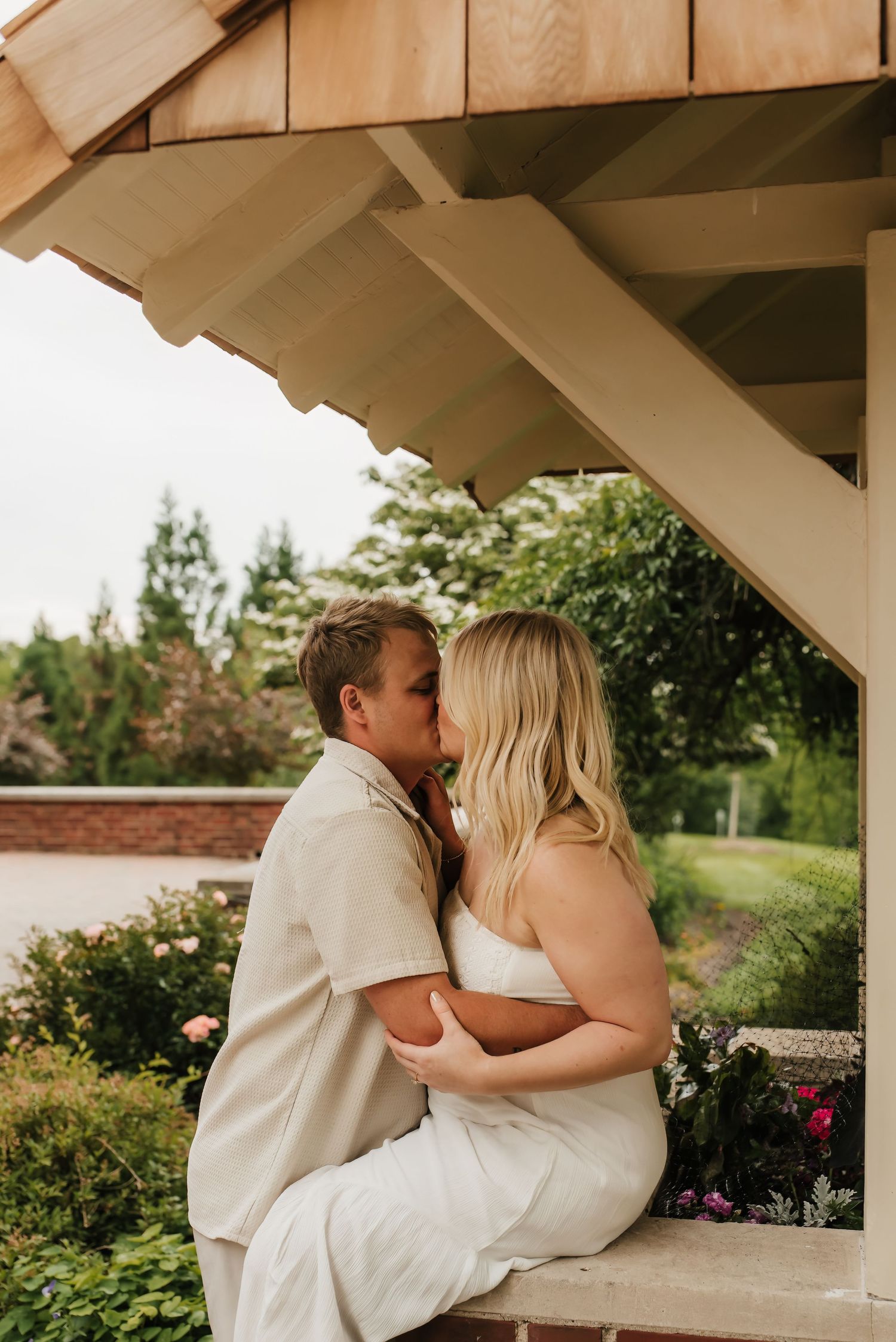 Couple kisses during their French park photo session