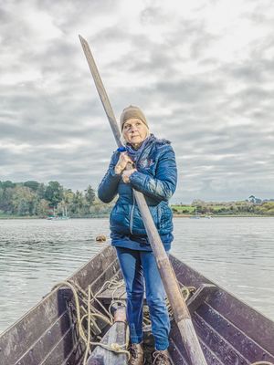 Sutton Hoo Longboat project - portrait of Jacq Barnard – Project Manager, photographed standing in boat on the River Deben, Suffolk