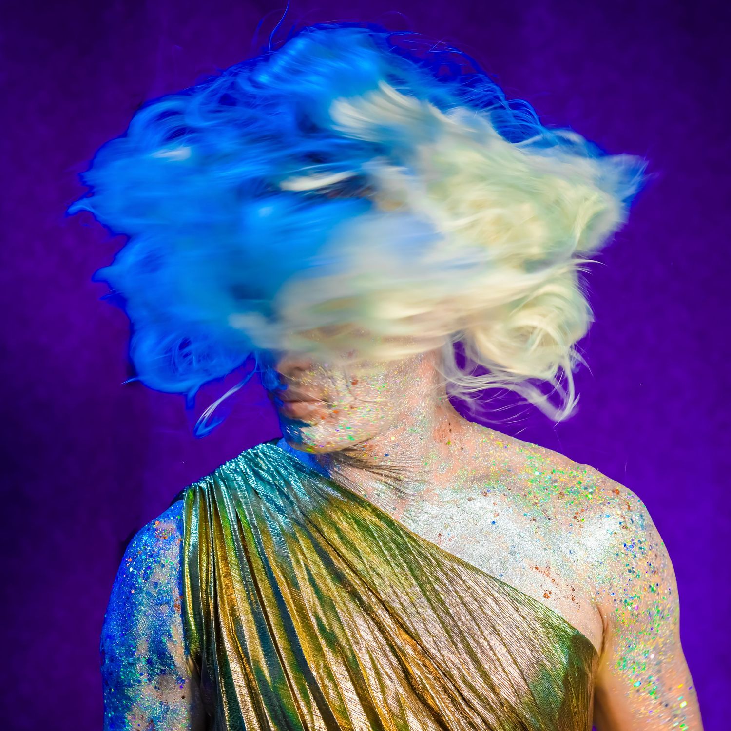 Abstract portrait with swirling blue and white hair motion against purple background.
