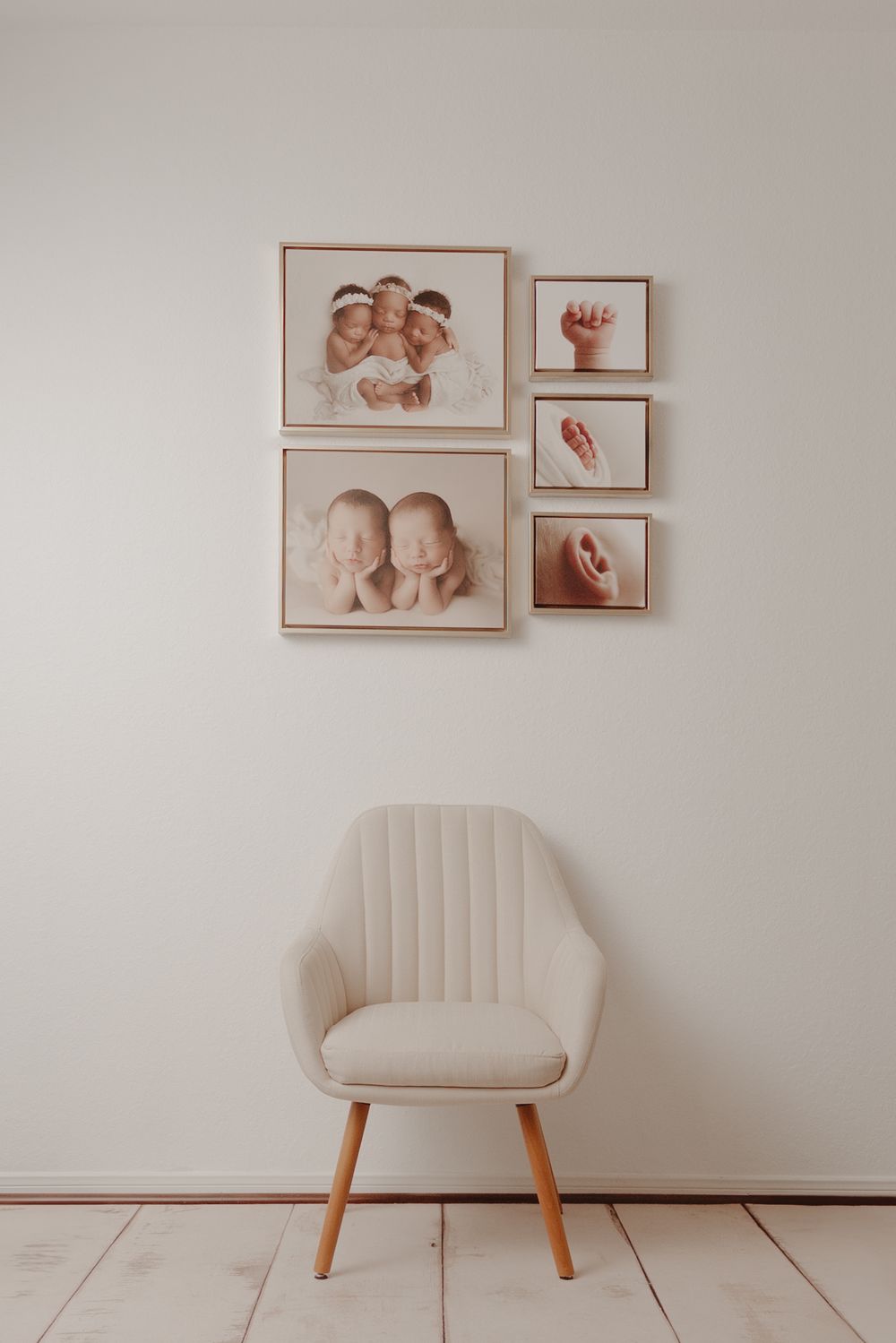 Minimalist home interior design with pale beige armchair and abstract wall art in muted tones creates serene atmosphere.