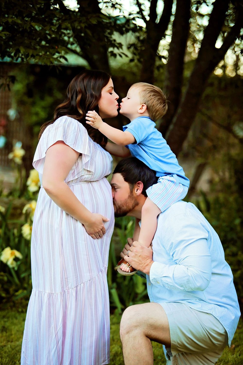 Sweet family moment captured outdoors with child and parents.