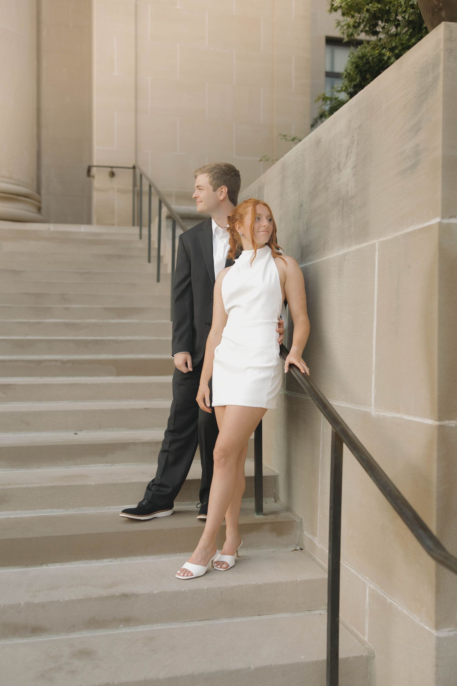 A series of four images showing someone in a white dress standing on concrete steps with a metal railing.