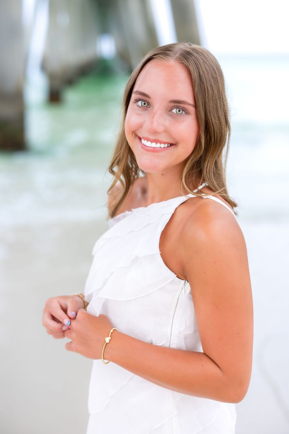 A series of portrait poses captured against a bright white background shows a summer lifestyle photo session.