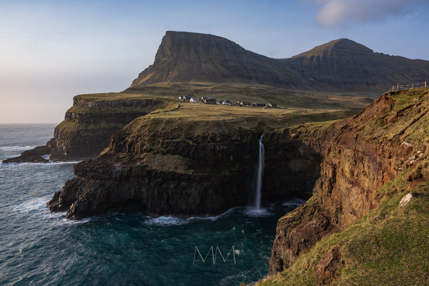 Faroe Islands coastline waterfall into the Atlantic Ocean