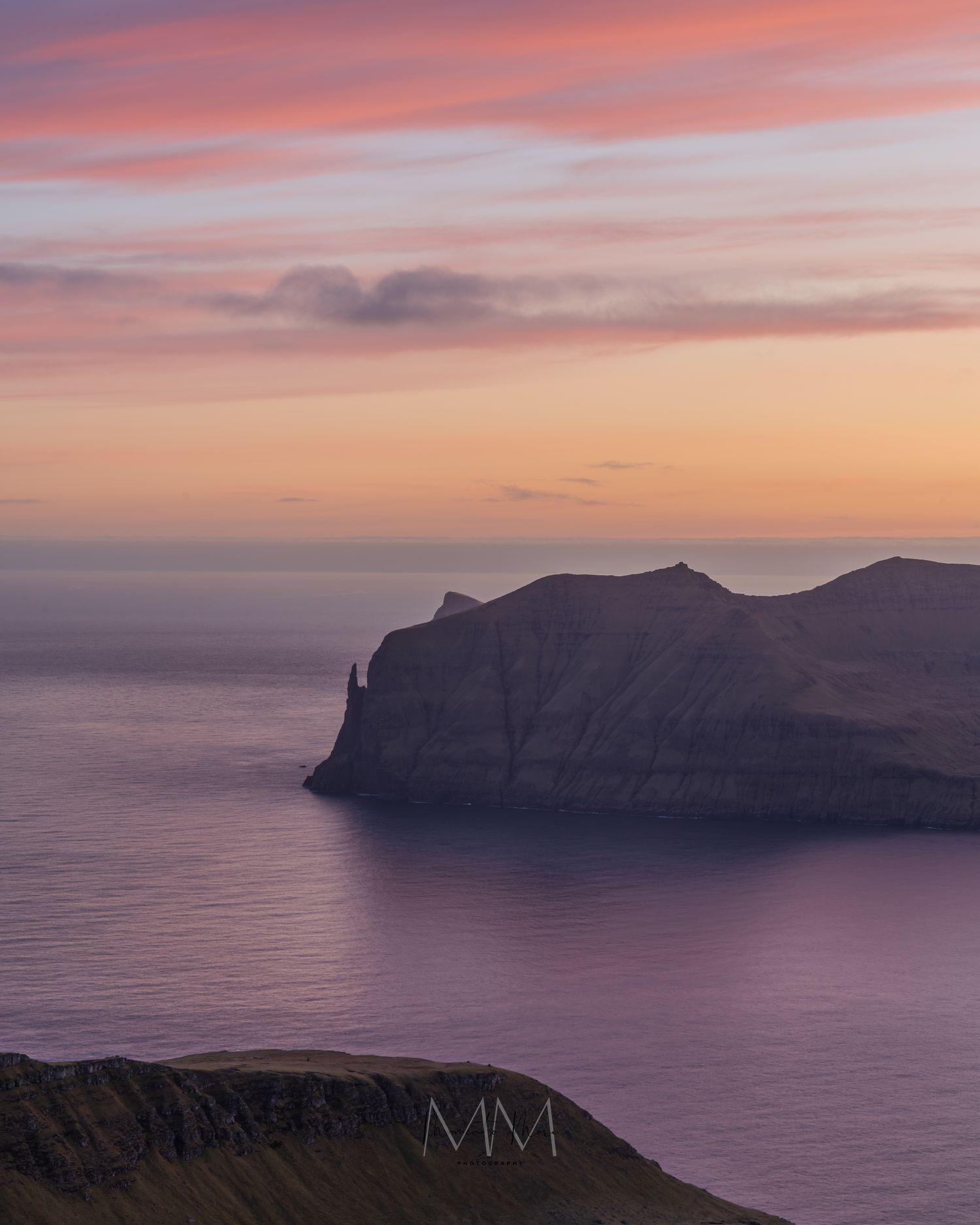 Purple and pink skies over the Faroe Islands fjords.