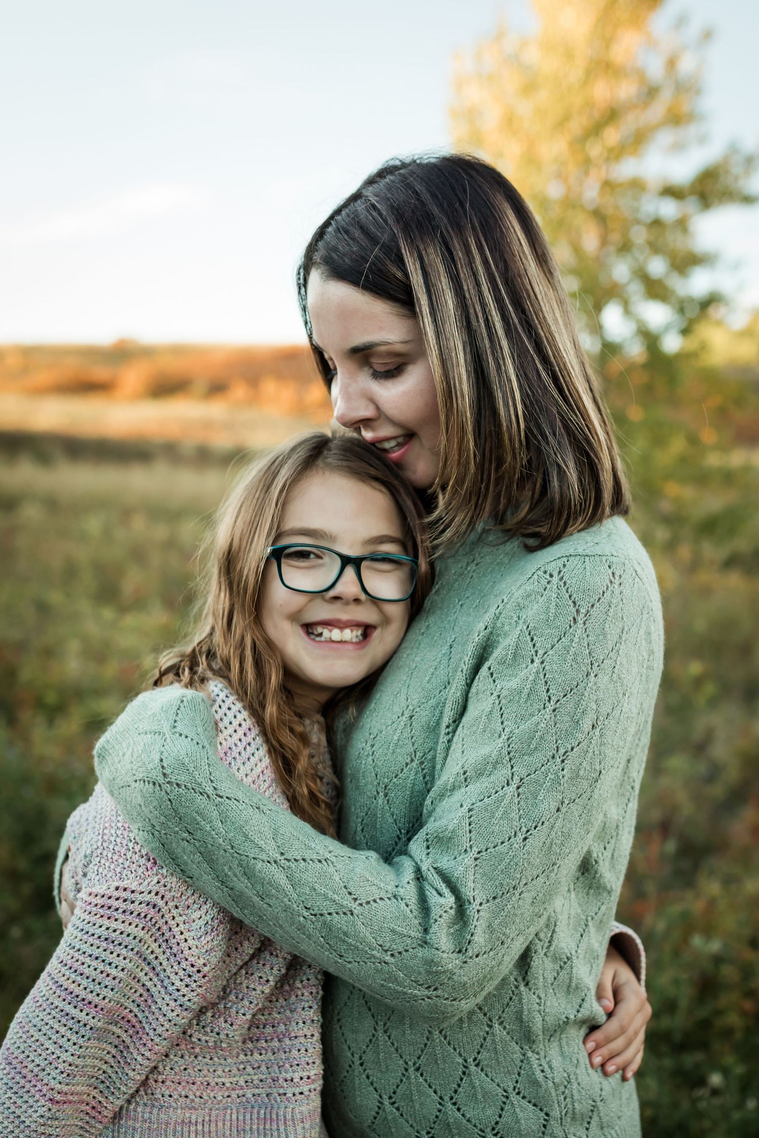Fall family lifestyle photos at Nose Hill Park at golden hour by Love & Sunshine Photography.