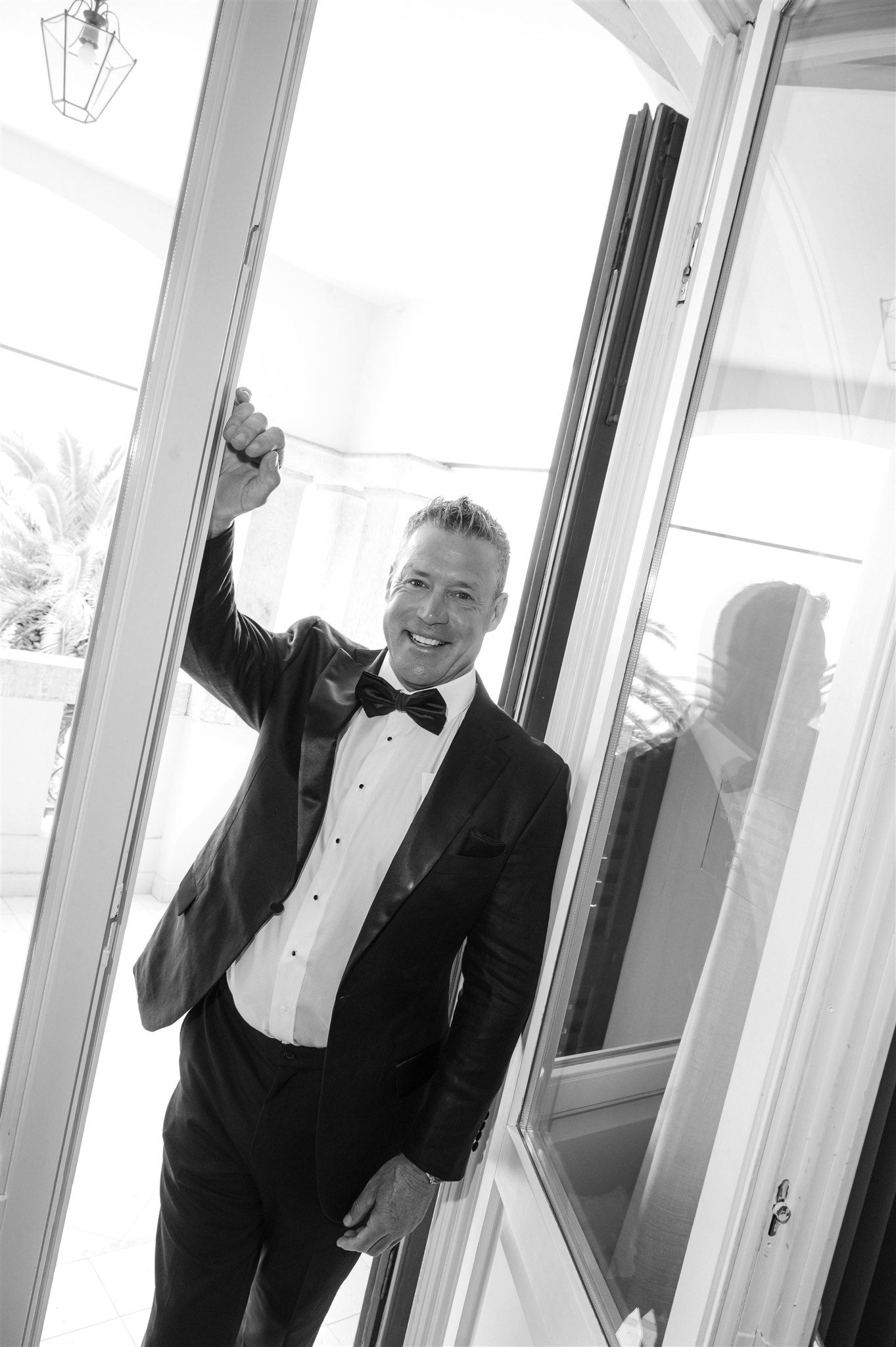 Black and white reflections in glass windows of a luxury Italian villa.