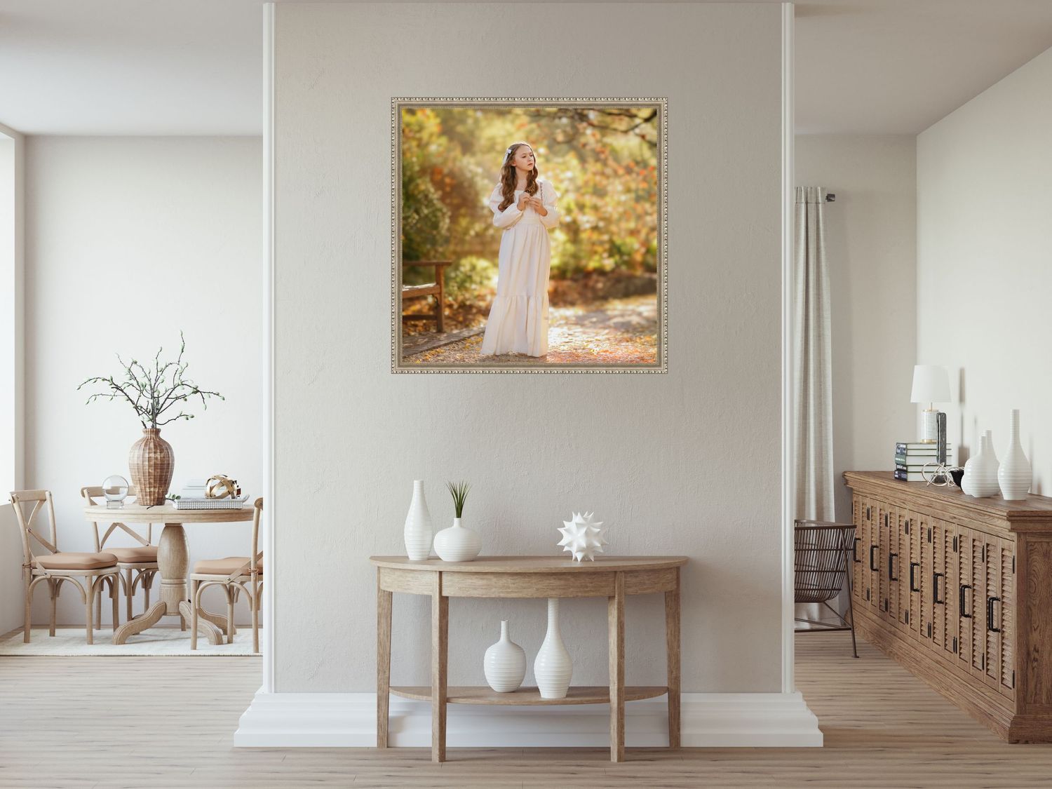 A wall-mounted portrait hangs above a wooden console table decorated with white vases in an elegant modern living room.