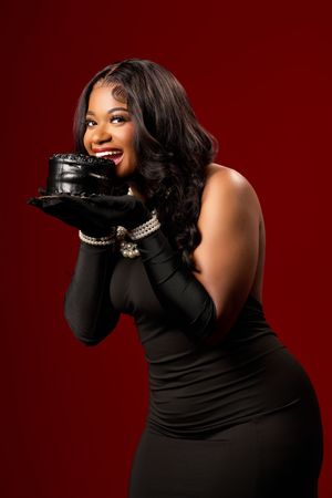 Glamorous fashion portrait series with person in black turtleneck and gloves posing dramatically against red backdrop.