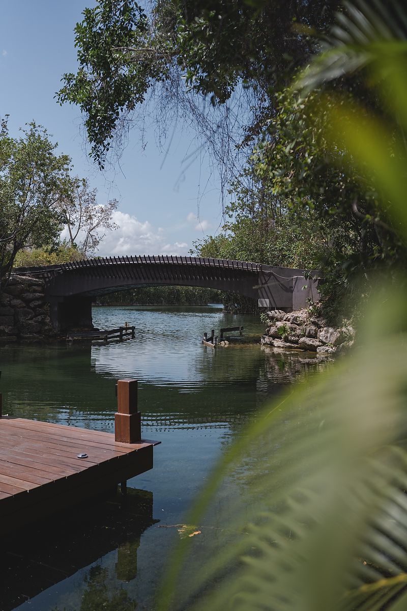 Scenic stone bridge at Fairmont Mayakoba Riviera Maya wedding photography.