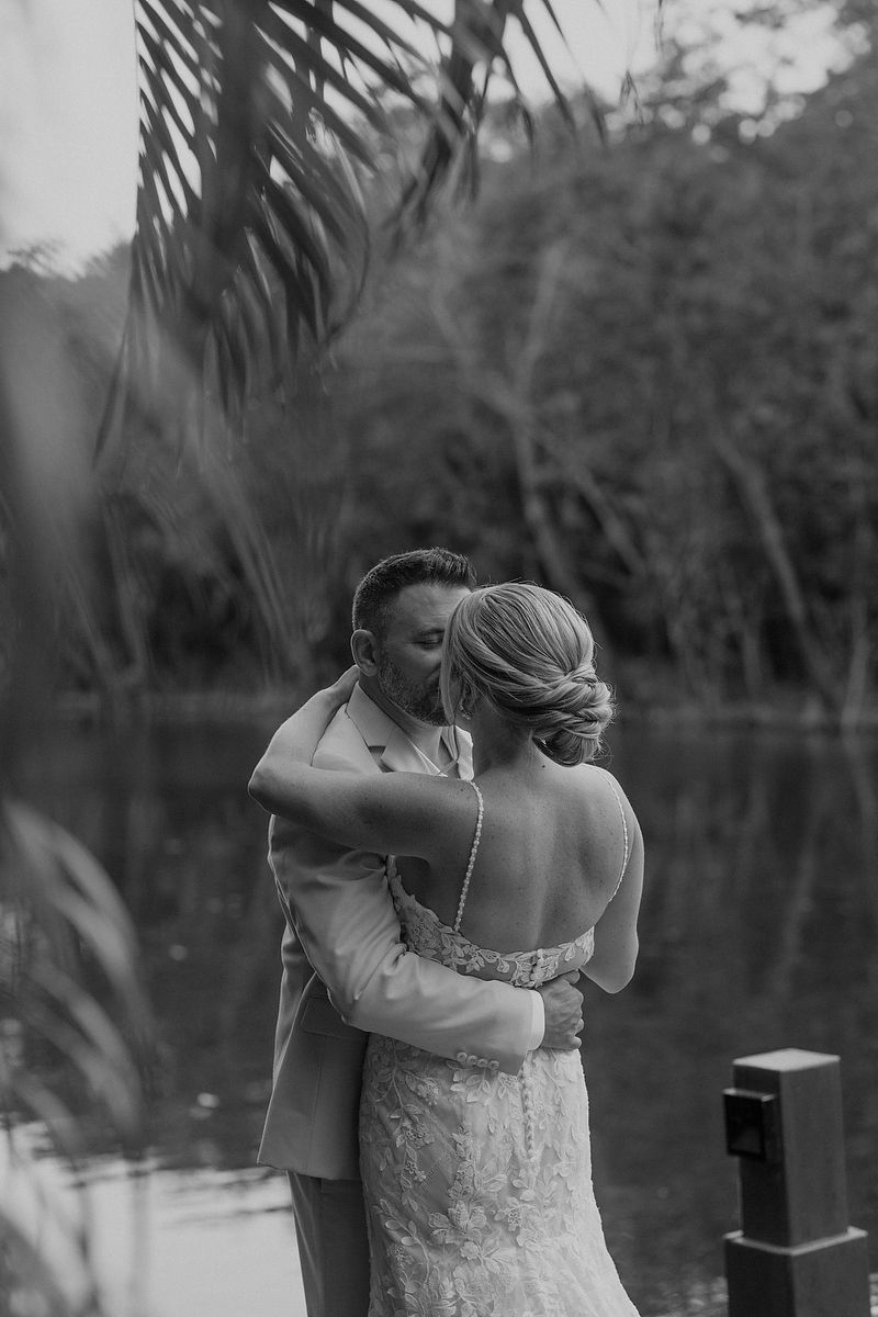 Bride and groom hugging at Fairmont Mayakoba Riviera Maya wedding photography.