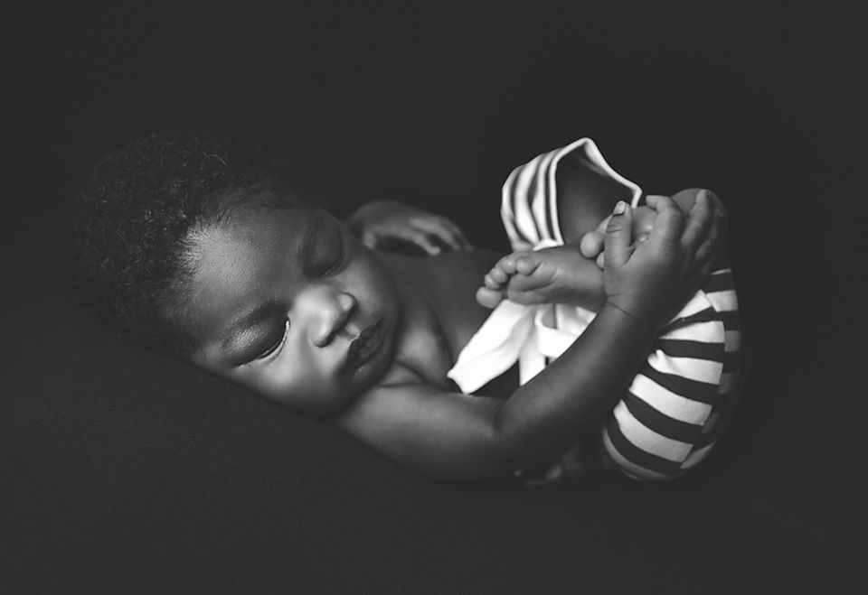 A series of black and white close-up photographs showing someone sleeping in dramatic lighting.