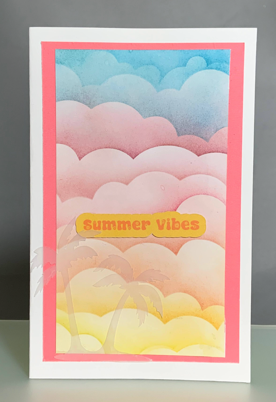 Card with a pastel ombre cloud design with text "Summer Vibes"