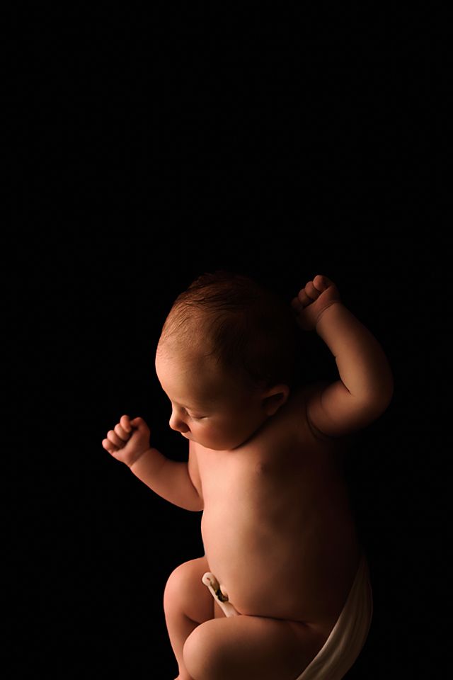 Artistic black and white photo series showing close-up silhouettes of a baby's body parts against dark background.