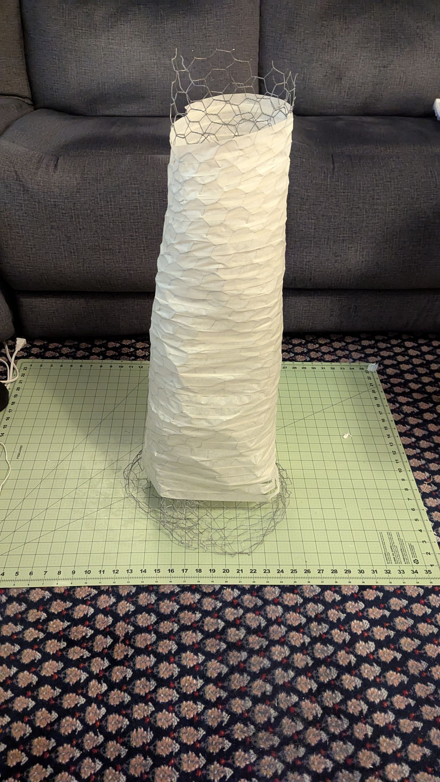 The chicken wire is covered in tissue paper.