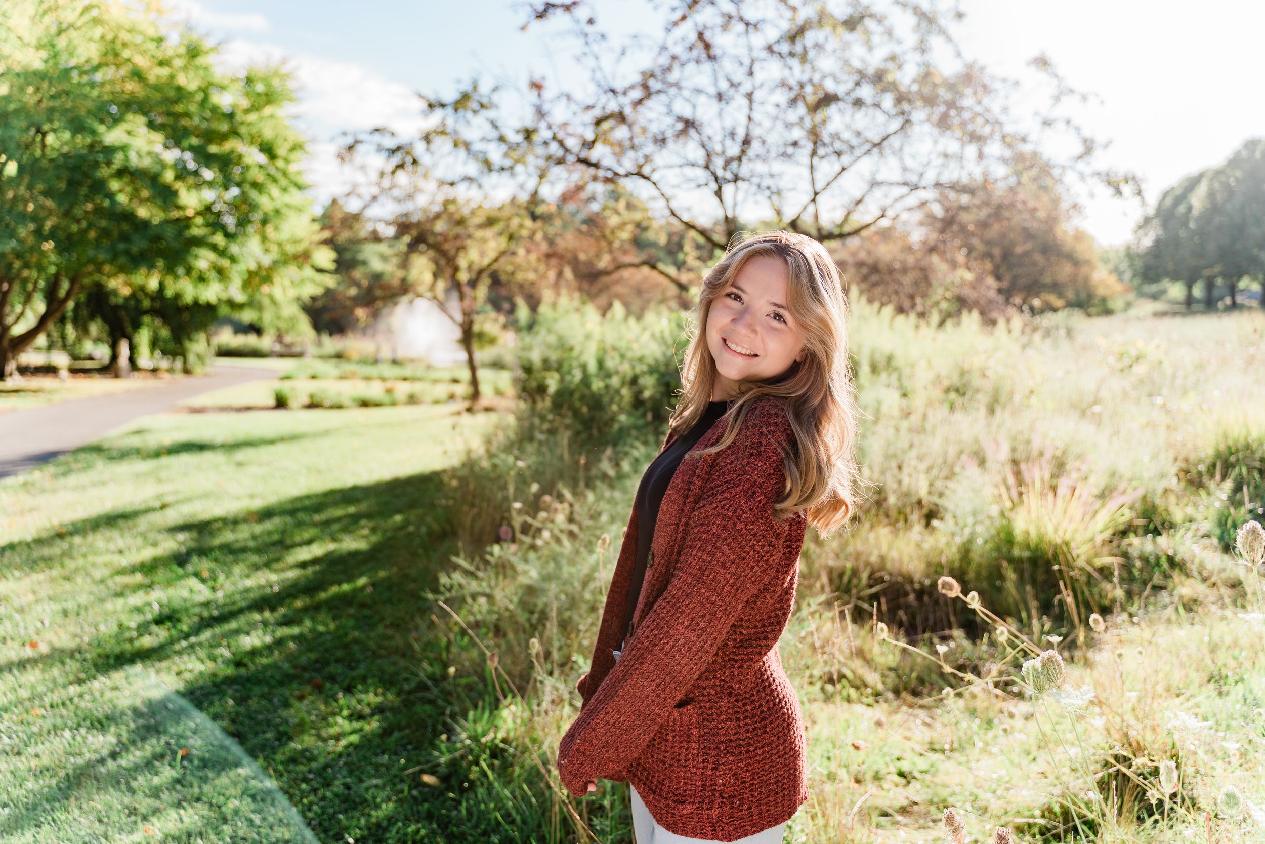 A series of outdoor portrait photos taken in a sunny natural setting with golden light and greenery.