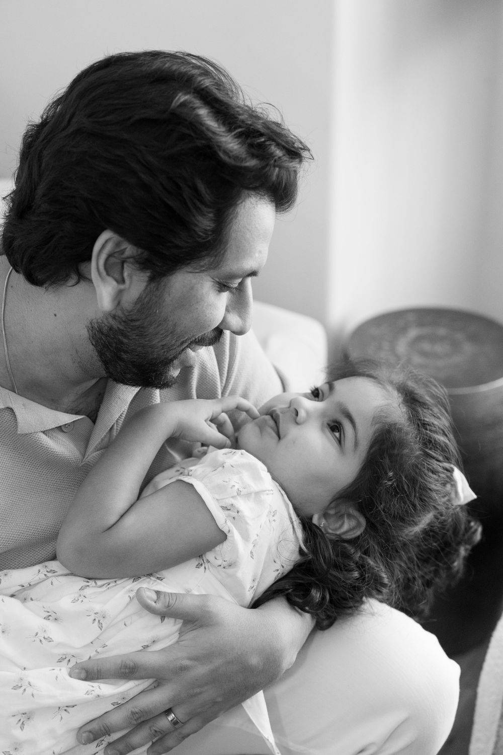 An intimate black and white photo series showing a tender moment between two people.