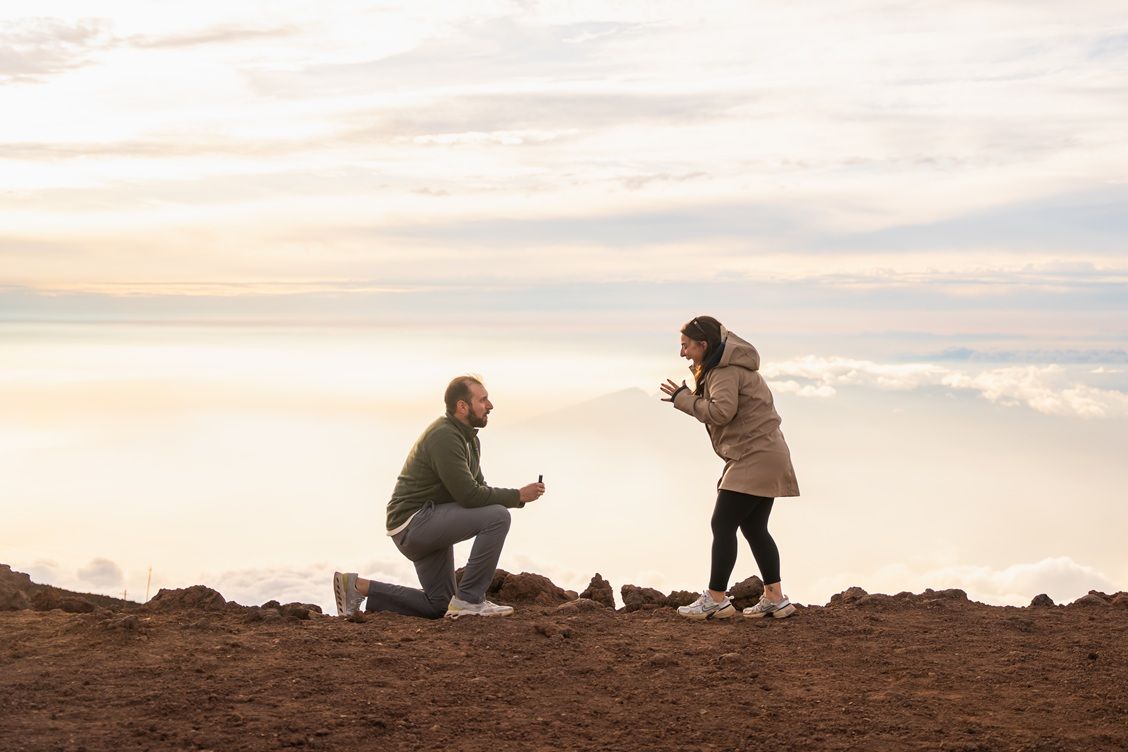 Proposal engagement couple sunset photo at Haleakala summit Maui Hawaii