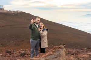 Proposal engagement couple sunset photo at Haleakala summit Maui Hawaii