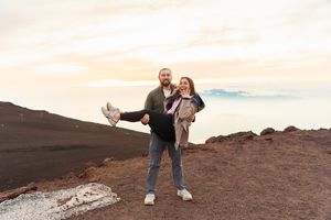 Proposal engagement couple sunset photo at Haleakala summit Maui Hawaii