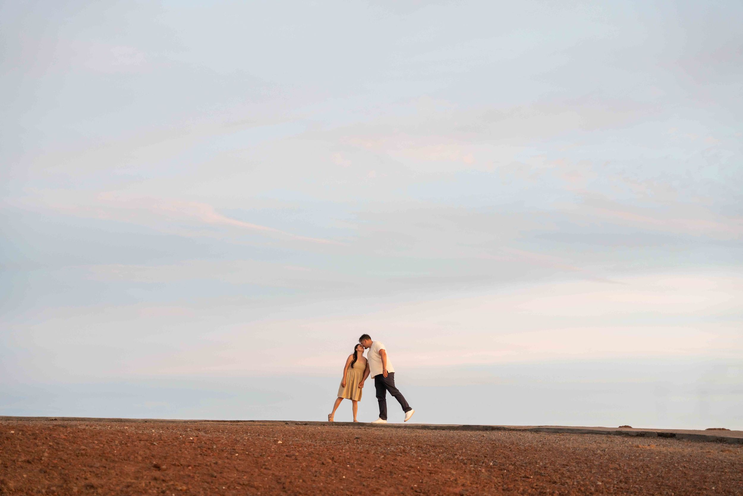 Proposal engagement couple sunset photo at Haleakala summit Maui Hawaii