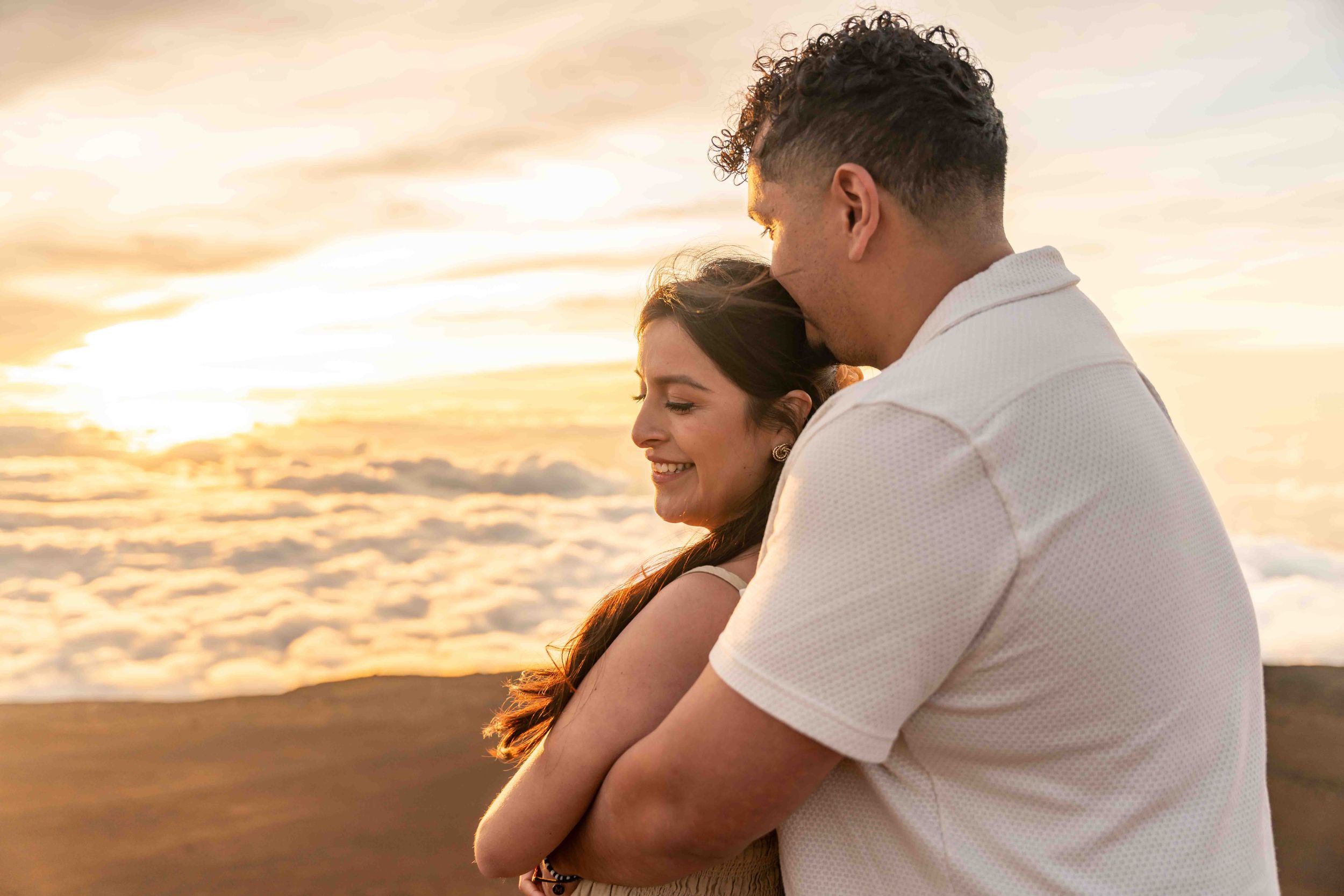 Proposal engagement couple sunset photo at Haleakala summit Maui Hawaii