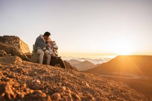 Proposal engagement couple sunrise photo at Haleakala summit Maui Hawaii