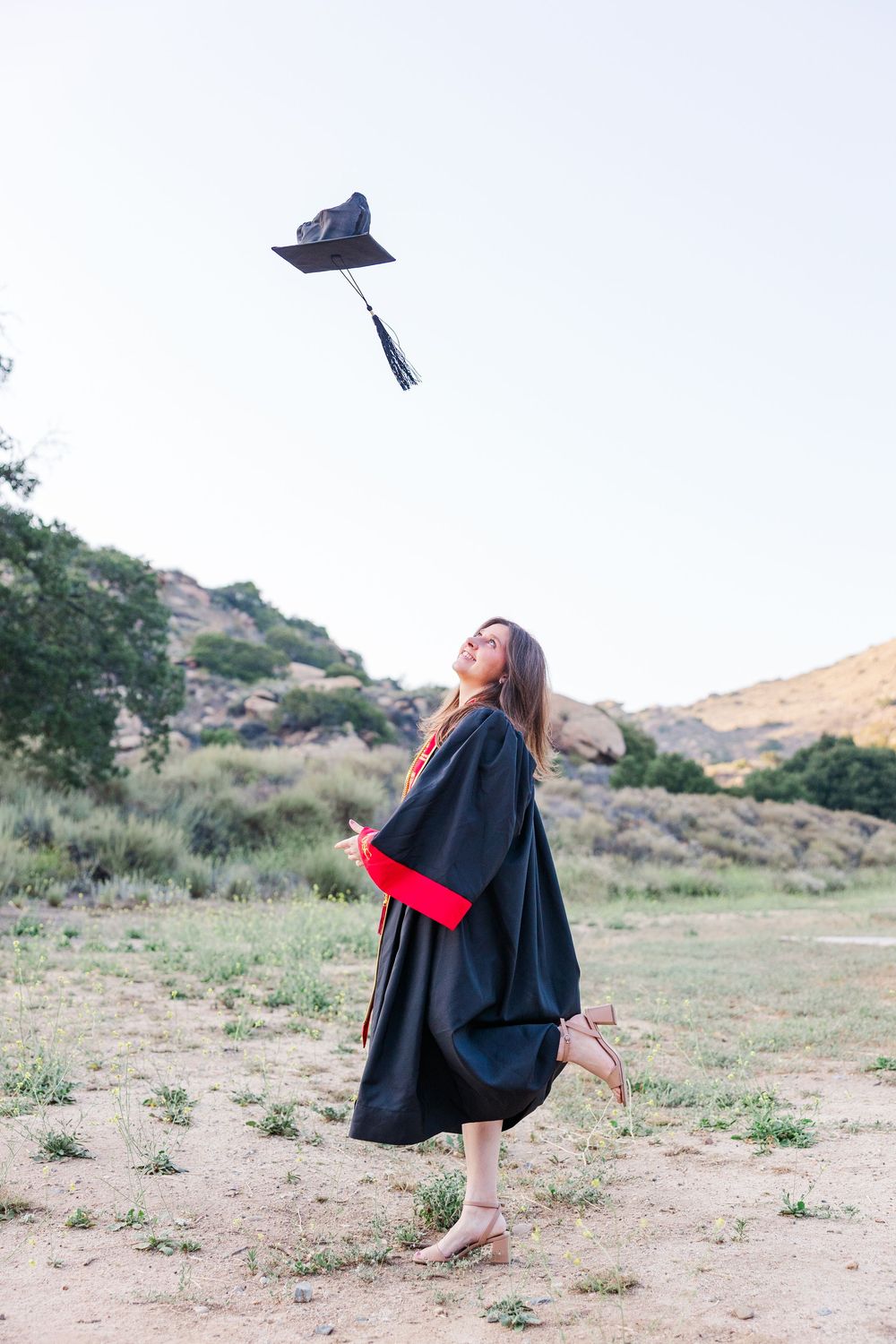 Simi Valley high school graduate posing at Corriganville Park with scenic trails and natural light for outdoor graduation portraits.