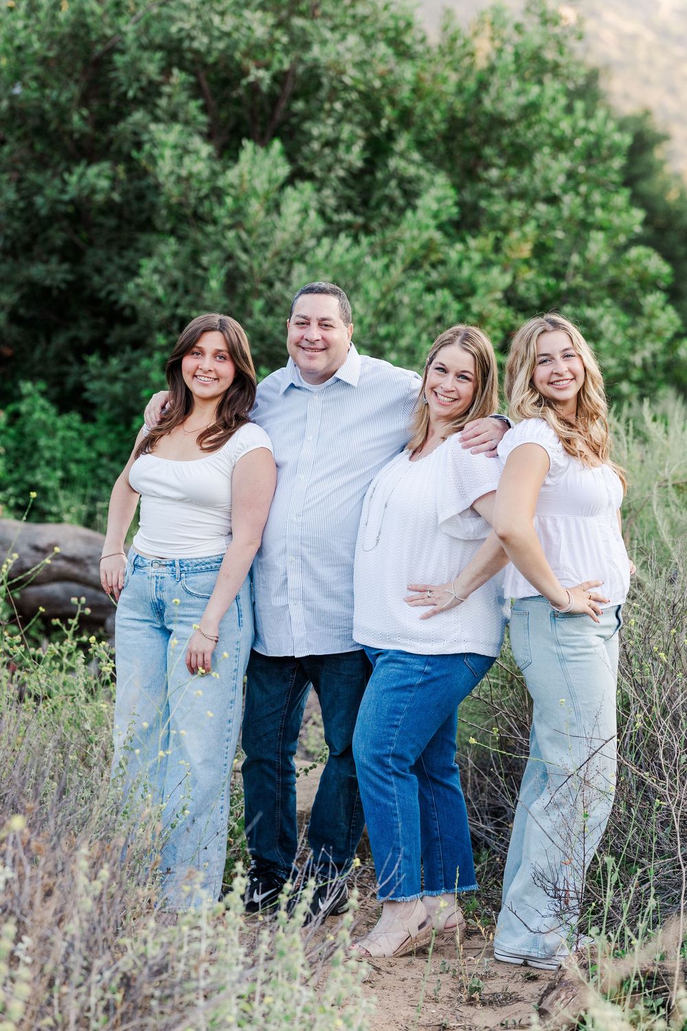 Simi Valley high school graduate posing at Corriganville Park with scenic trails and natural light for outdoor graduation portraits.