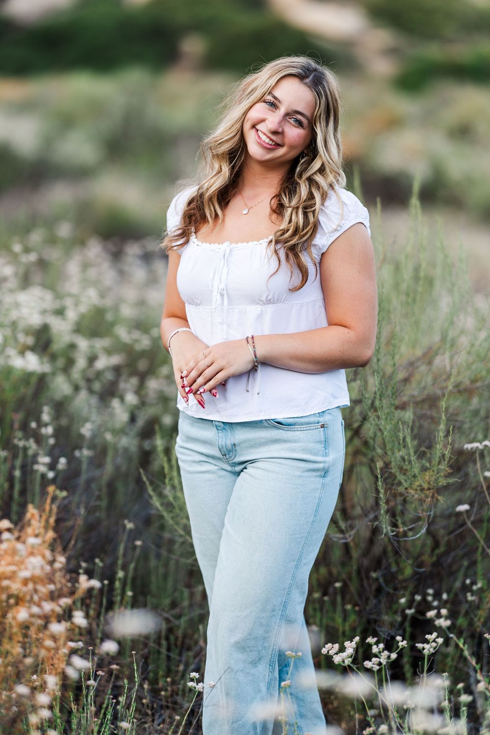 Simi Valley high school graduate posing at Corriganville Park with scenic trails and natural light for outdoor graduation portraits.