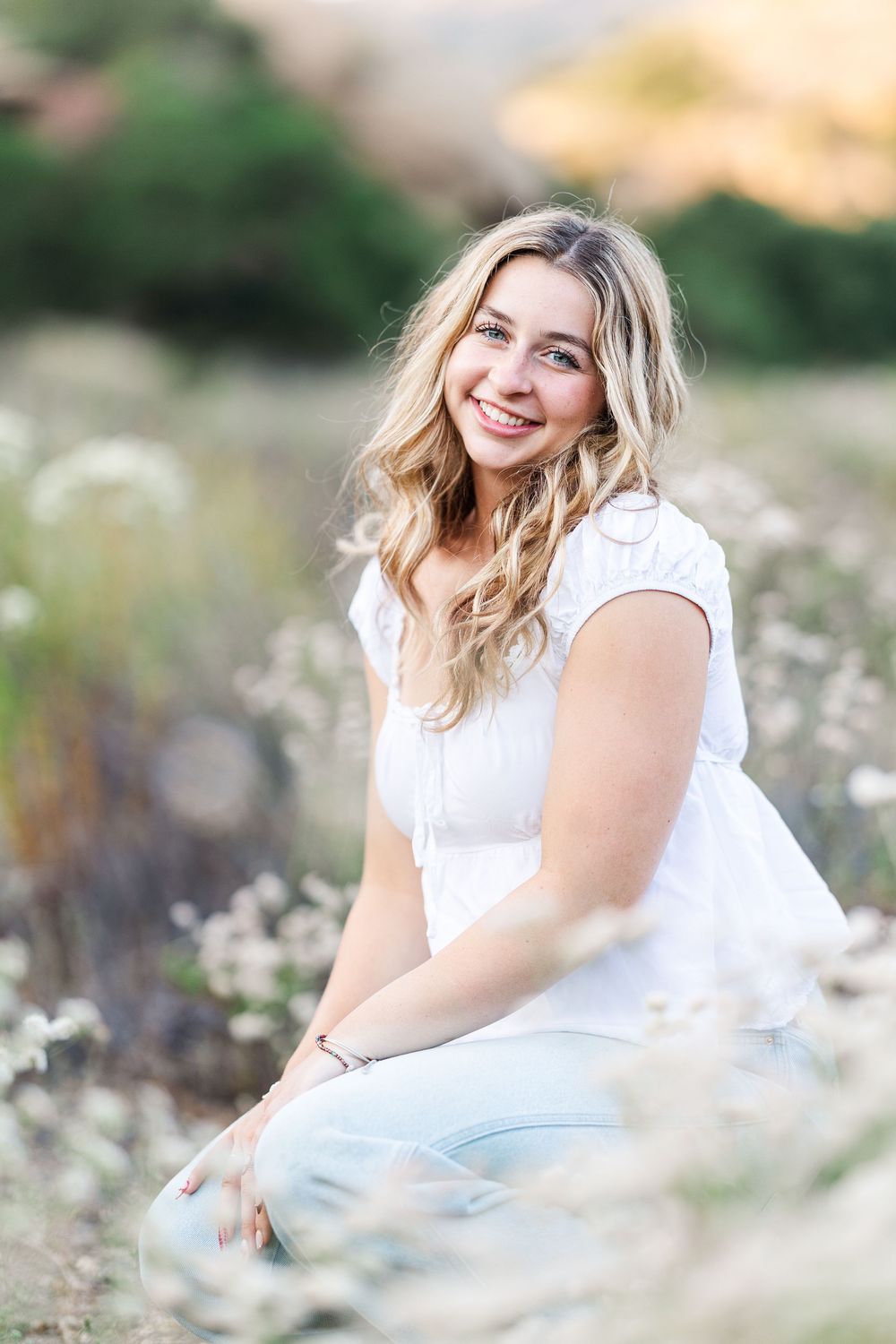 Simi Valley high school graduate posing at Corriganville Park with scenic trails and natural light for outdoor graduation portraits.